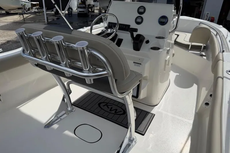 Slide: The Image of 2026 Key West 203 FS boat interior with helm, seating, and rod holders. - 19