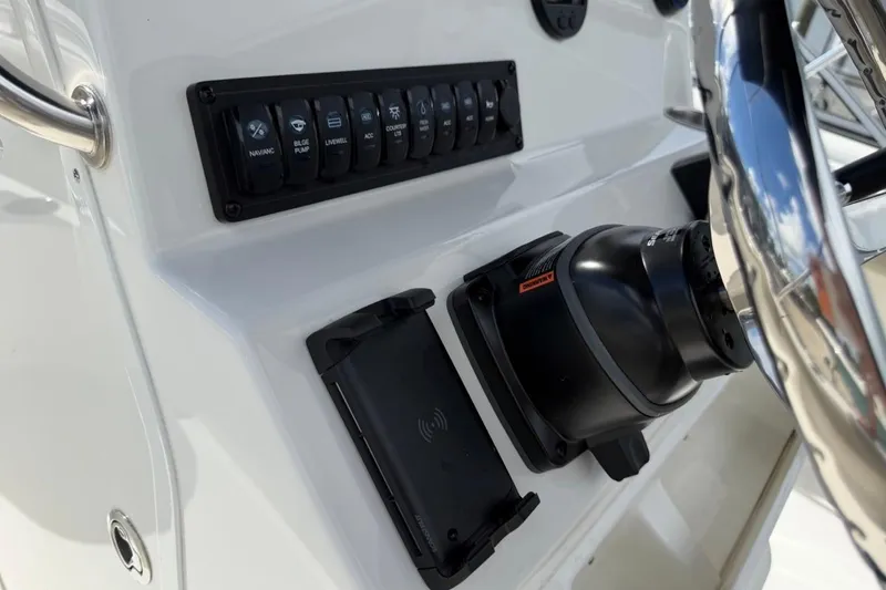 Slide: The Image of 2026 Key West 203 FS boat dashboard with steering wheel and control panel. - 21