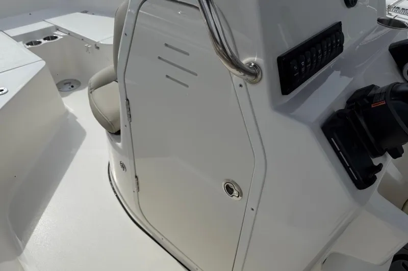 Slide: The Image of 2026 Key West 203 FS boat interior with control panel and seating. - 23