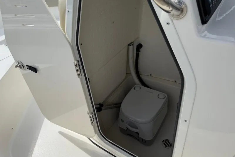 Slide: The Image of 2026 Key West 203 FS boat interior with compact marine toilet. - 24