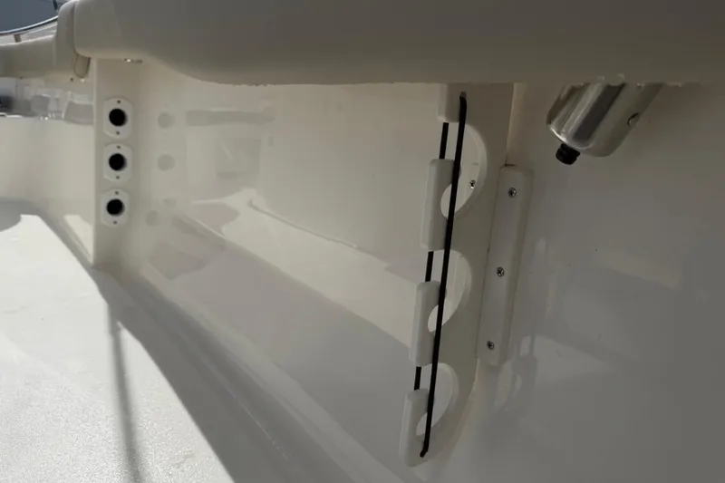 Slide: The Image of Interior view of 2026 Key West 203 FS boat, showcasing rod holders and sleek design. - 26