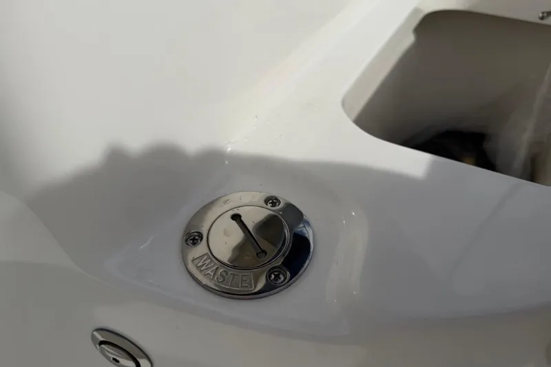 Slide: The Image of Waste compartment on 2026 Key West 203 FS boat, featuring a sleek white surface. - 29
