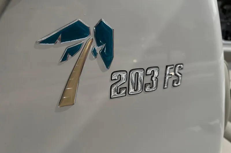 Slide: The Image of Key West 203 FS 2026 model emblem on boat exterior. - 32
