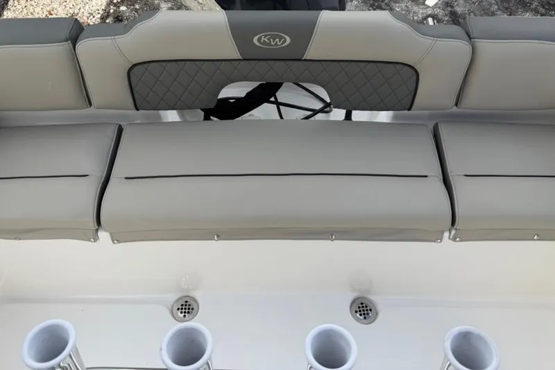 Slide: The Image of 2026 Key West 203 FS boat seating with rod holders and quilted backrest. - 8