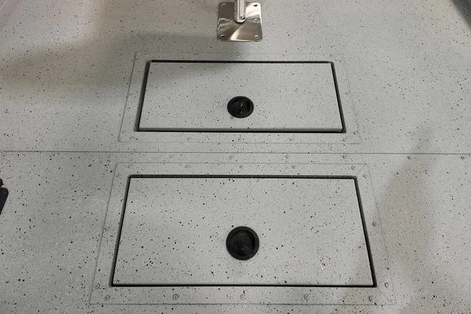 Slide: The Image of 2024 SeaArk Shadow 18 t boat deck with storage compartments. - 13