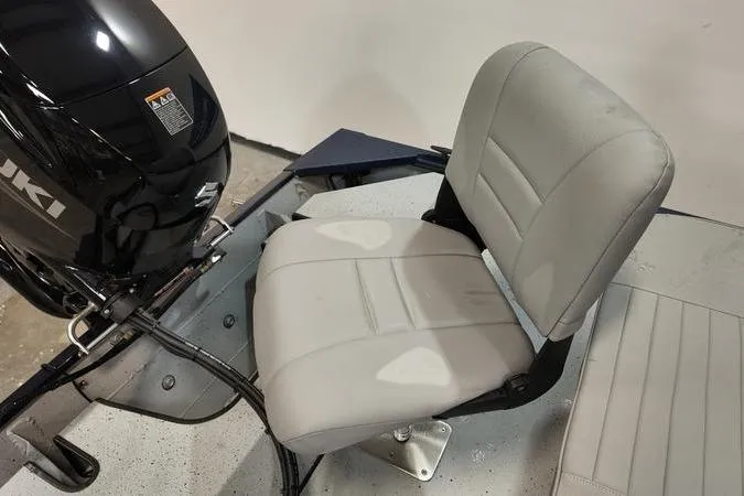 Slide: The Image of 2024 SeaArk Shadow 18 t boat with Suzuki motor and gray seating. - 5