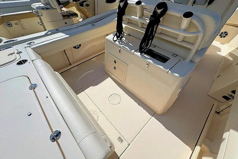 Slide: The Image of 2021 Grady-White Canyon 271 boat interior with seating and storage compartments. - 10