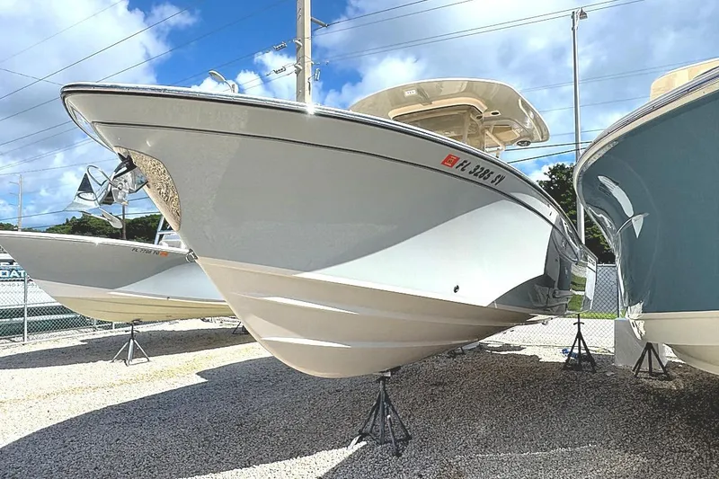Slide: The Image of 2021 Grady-White Canyon 271 boat displayed outdoors on stands. - 5