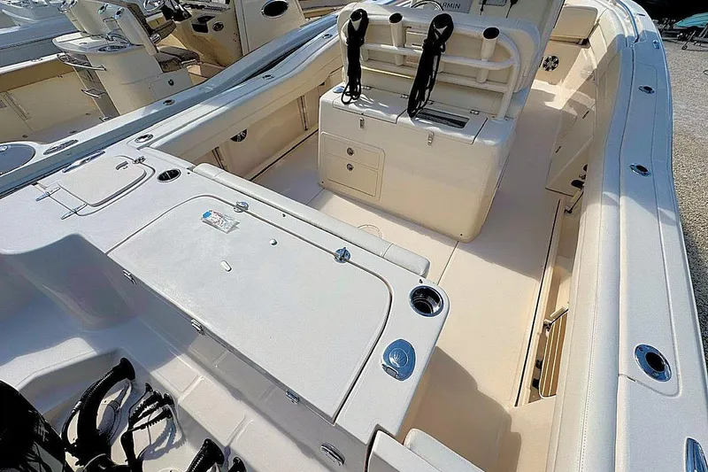 Slide: The Image of 2021 Grady-White Canyon 271 boat interior with seating and storage compartments. - 9