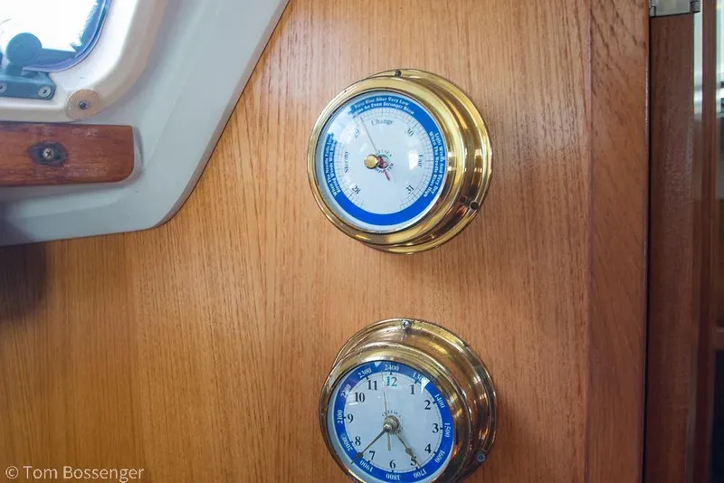 Slide: The Image of Brass barometer and clock on 1997 Catalina 320 MkII sailboat wooden interior. - 19