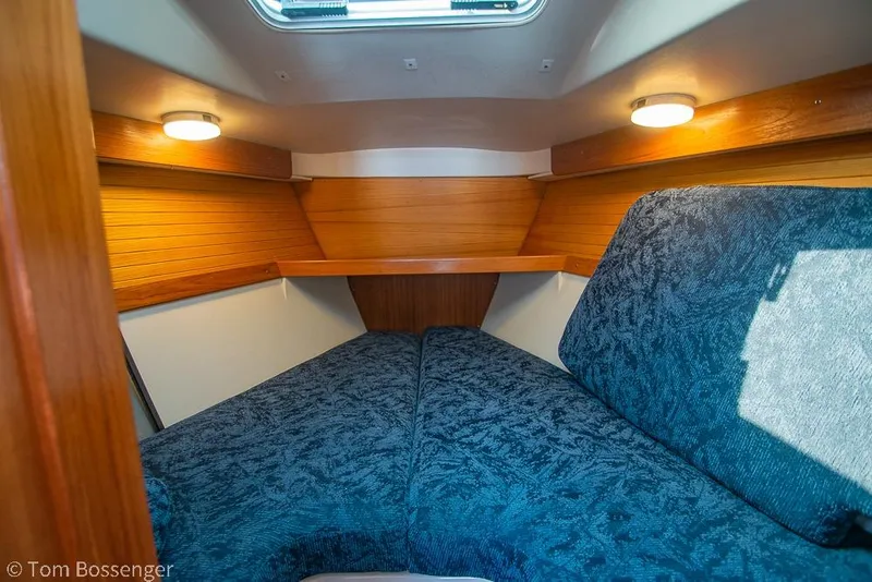 Slide: The Image of Interior cabin of 1997 Catalina 320 MkII sailboat with cozy blue upholstery. - 20