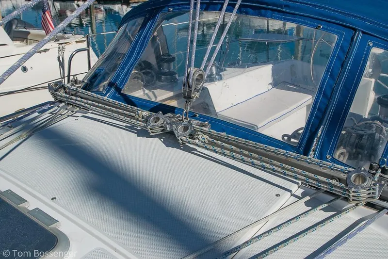 Slide: The Image of 1997 Catalina 320 MkII sailboat deck with blue canopy and rigging details. - 38