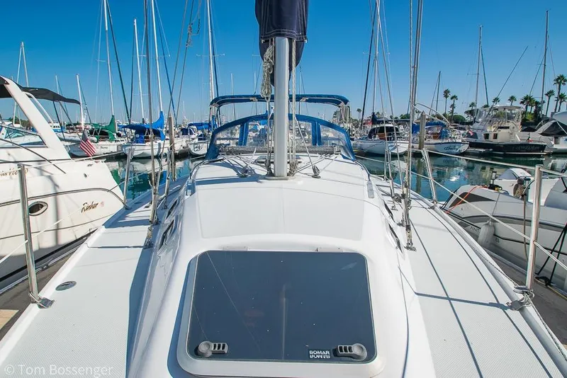 Slide: The Image of Catalina 320 MkII sailboat, 1997 model, docked in a marina under clear blue skies. - 41