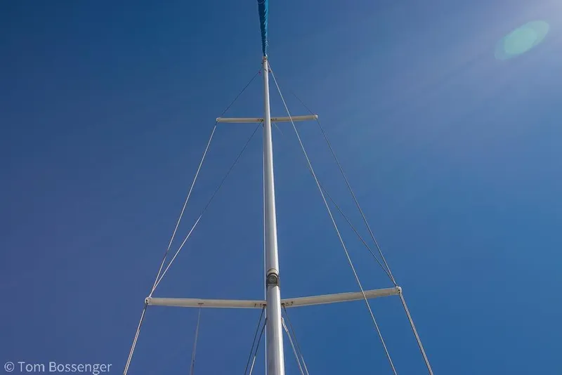 Slide: The Image of Mast of 1997 Catalina 320 MkII sailboat against clear blue sky. - 42