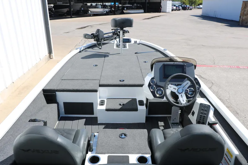 Slide: The Image of 2025 Vexus AVX 2080 boat interior with steering console and seating. - 16