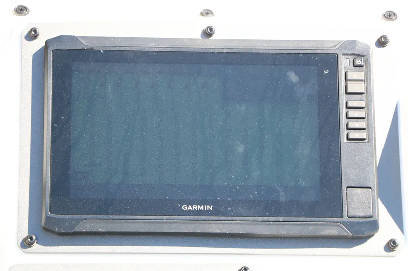 Slide: The Image of Garmin display on 2025 Vexus AVX 2080 boat dashboard, featuring control buttons. - 21