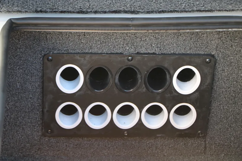 Slide: The Image of Rod holder panel on 2025 Vexus AVX 2080 boat, featuring multiple circular slots. - 22