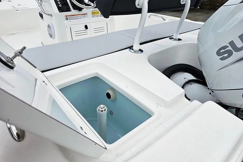 Slide: The Image of 2026 Sea Pro 172 Bay boat with open storage compartment and visible engine. - 10