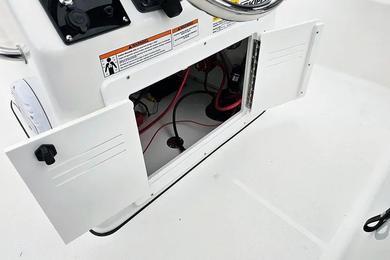 Slide: The Image of Open storage compartment on 2026 Sea Pro 172 Bay boat, showing wiring and equipment. - 12