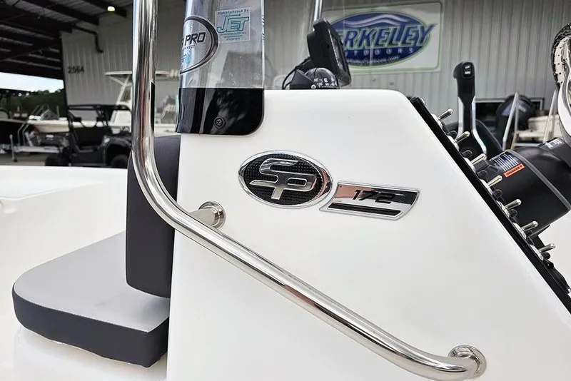 Slide: The Image of 2026 Sea Pro 172 Bay boat console with logo and controls in a showroom. - 20