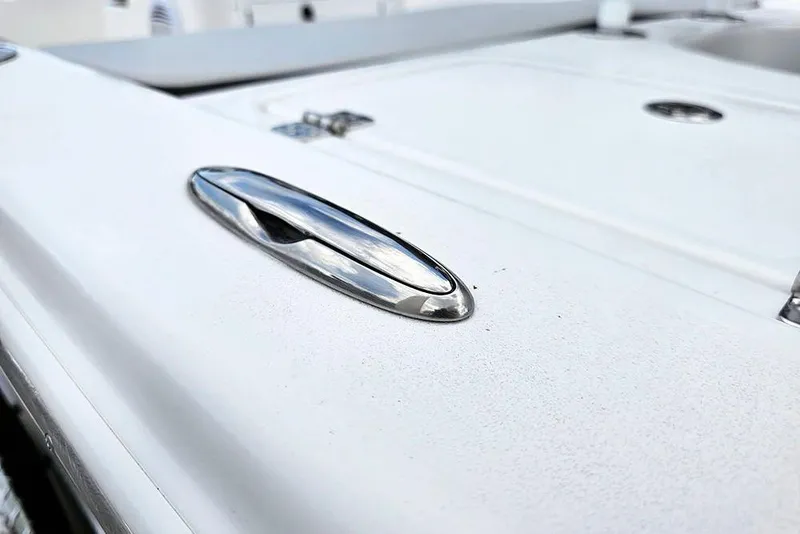 Slide: The Image of Close-up of 2026 Sea Pro 172 Bay boat's sleek chrome detail on white surface. - 21