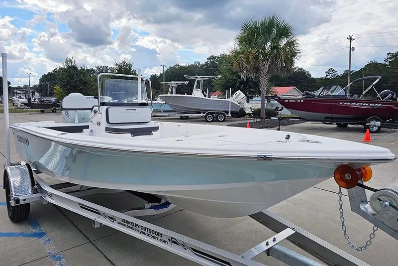 Slide: The Image of 2026 Sea Pro 172 Bay boat on trailer under cloudy sky at dealership. - 5