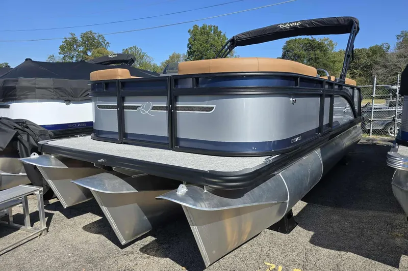 The Image of 2026 Qwest RLS E-Class pontoon boat with sleek design and tan seating. - 1