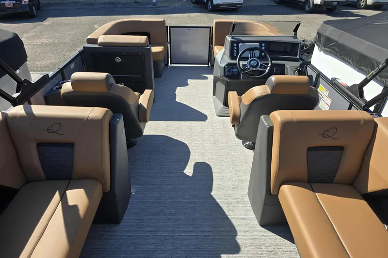 Slide: The Image of 2026 Qwest RLS E-Class boat interior with luxurious tan seating and modern dashboard. - 10