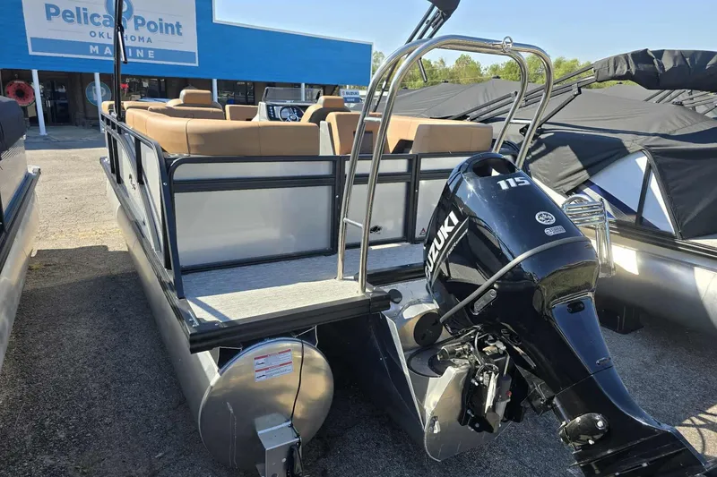 Slide: The Image of 2026 Qwest RLS E-Class pontoon boat with Suzuki 115 engine at Pelican Point Marine. - 3