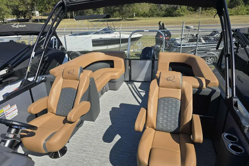 Slide: The Image of Luxurious interior of 2026 Qwest RLS E-Class boat with tan leather seating. - 8