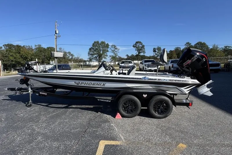 Slide: The Image of 2026 Phoenix 721 ZXL boat on trailer in parking lot, clear sky background. - 1