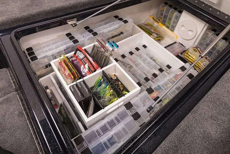 Slide: The Image of Organized fishing tackle storage in a 2026 Phoenix 721 ZXL boat compartment. - 18