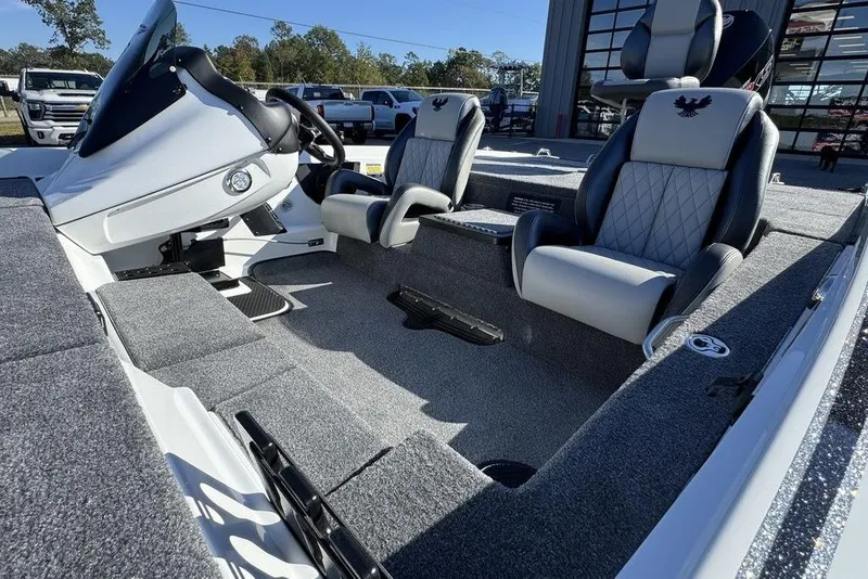Slide: The Image of 2026 Phoenix 721 ZXL boat interior with plush seating and modern dashboard. - 6