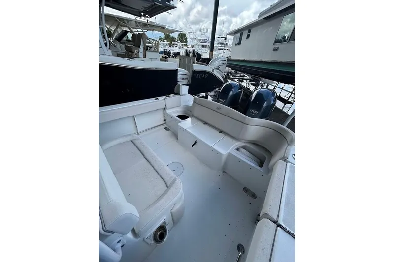 Slide: The Image of 2023 Seahunt SXS boat interior with Yamaha engines, docked at marina. - 11