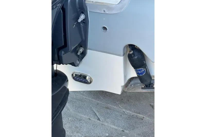 Slide: The Image of 2023 Sea Hunt Ultra 265 SE boat detail, featuring engine mount and hydraulic components. - 17