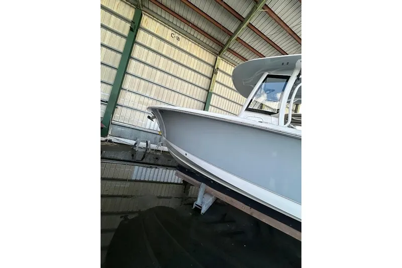 Slide: The Image of 2023 Seahunt SXS boat in storage, showcasing sleek design and modern features. - 3