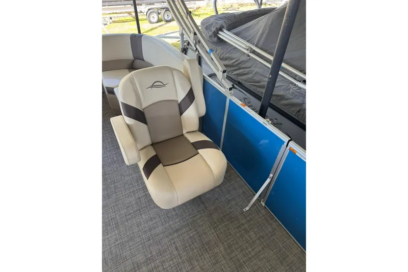 Slide: The Image of Captain's chair on 2026 SunCatcher Select 22RC pontoon boat, featuring beige and brown upholstery. - 3
