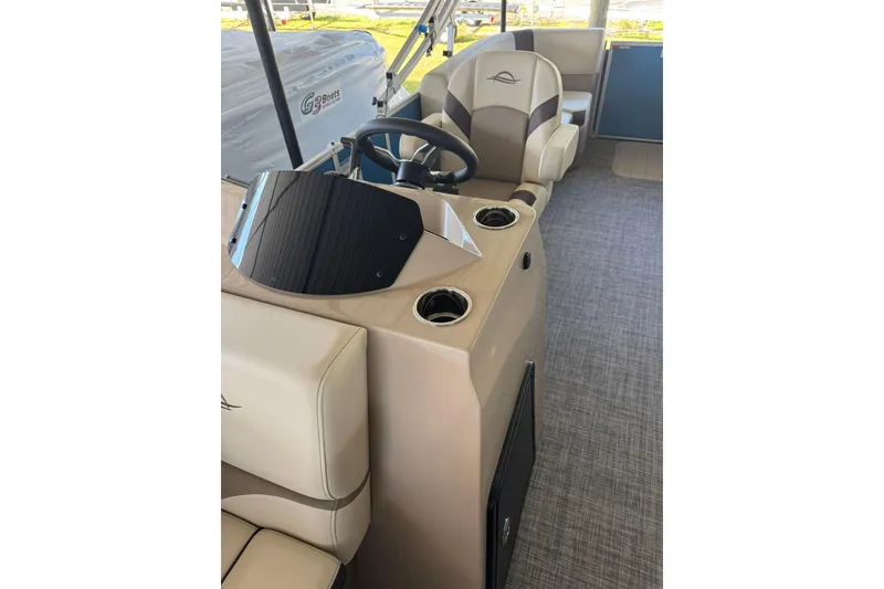 Slide: The Image of Interior of 2026 SunCatcher Select 22RC boat with steering wheel and seating. - 5