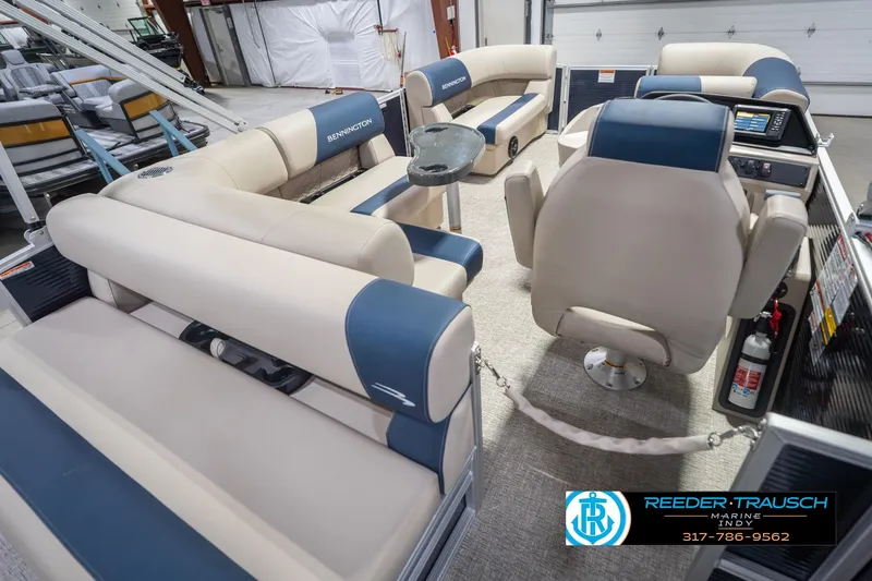 Slide: The Image of Interior of 2026 Bennington 168 SLJ pontoon boat with beige and blue seating. - 14
