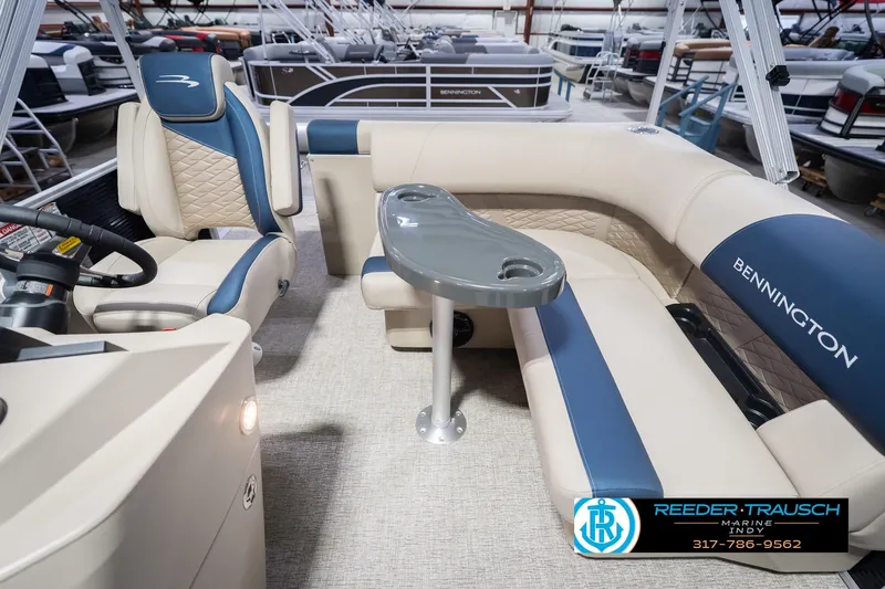 Slide: The Image of 2026 Bennington 168 SLJ pontoon boat interior with beige and blue seating. - 17