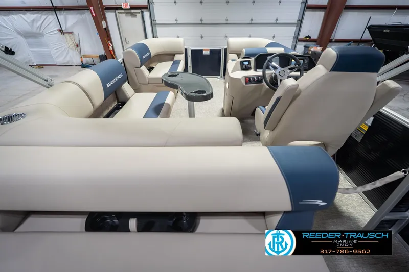 Slide: The Image of Interior of 2026 Bennington 168 SLJ pontoon boat with plush seating and modern controls. - 19
