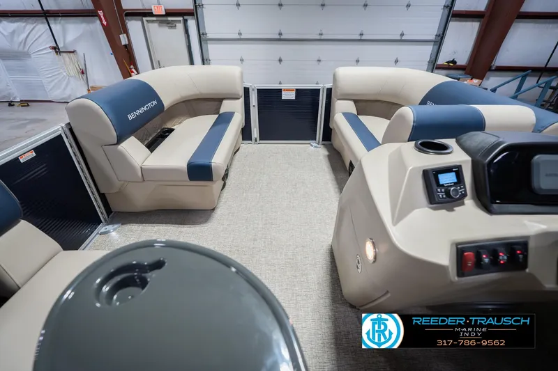 Slide: The Image of Interior of 2026 Bennington 168 SLJ pontoon boat with beige and blue seating. - 20