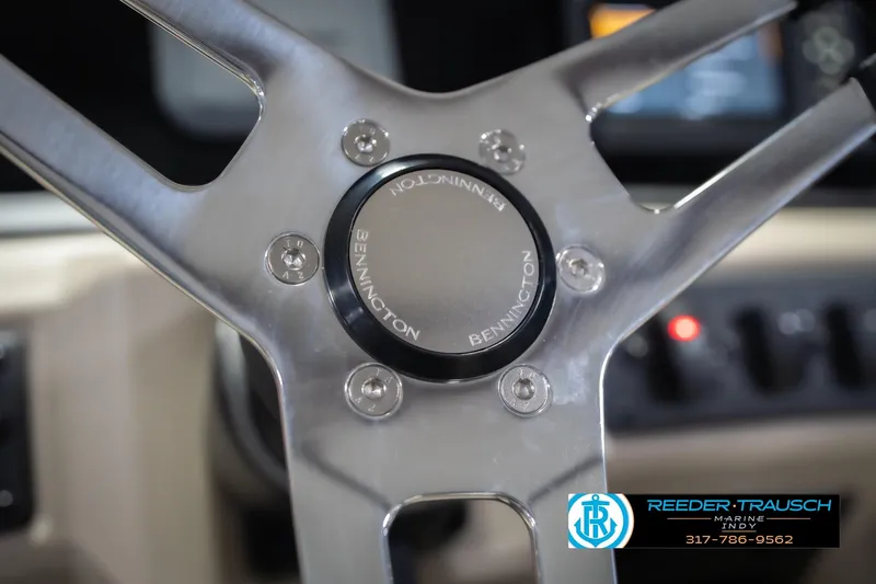 Slide: The Image of Steering wheel of 2026 Bennington 168 SLJ boat, featuring sleek metallic design. - 31
