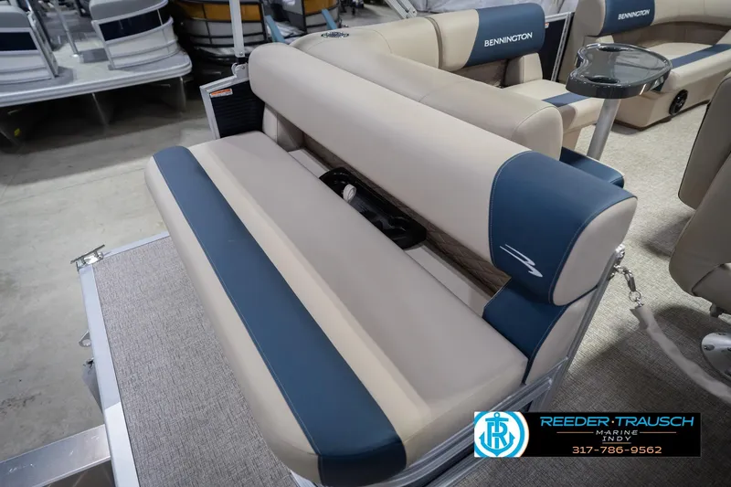 Slide: The Image of 2026 Bennington 168 SLJ boat interior with beige and blue seating, showcased at Reeder Trausch Marine. - 41