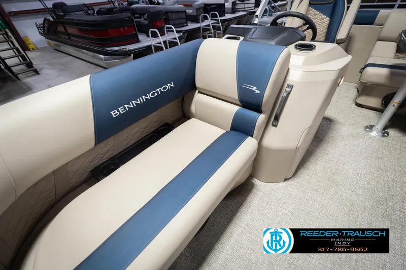 Slide: The Image of 2026 Bennington 168 SLJ boat interior with blue and beige seating, showcased at Reeder-Trausch Marine. - 42