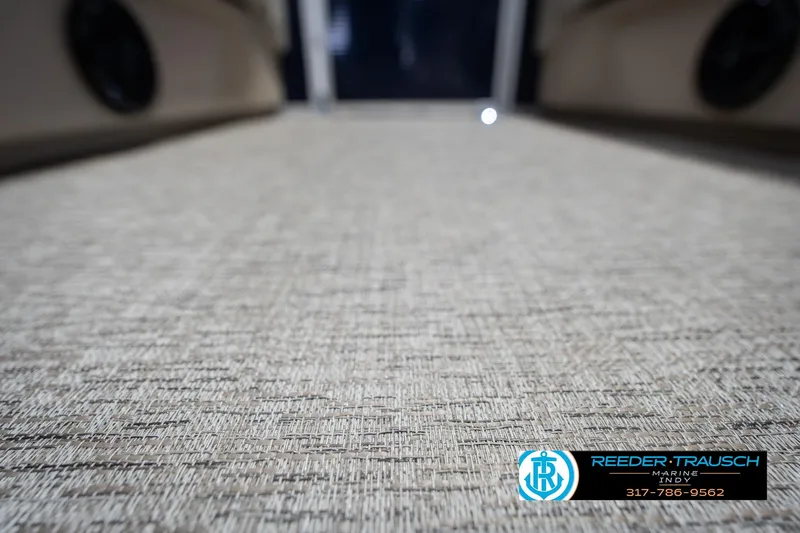 Slide: The Image of 2026 Bennington 168 SLJ boat interior flooring with textured design, Reeder-Trausch Marine logo. - 45