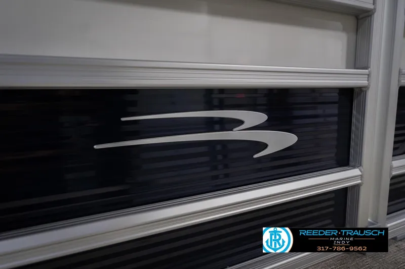 Slide: The Image of 2026 Bennington 168 SLJ boat panel with logo and Reeder-Trausch Marine contact details. - 46