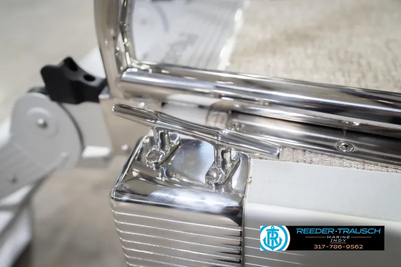 Slide: The Image of 2026 Bennington 168 SLJ boat detail with chrome fittings and Reeder Trausch Marine logo. - 59