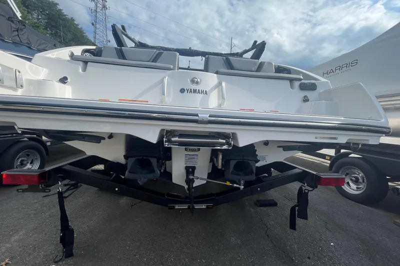 Slide: The Image of 2026 Yamaha Boats 222XD on trailer, rear view, showcasing sleek design and dual engines. - 11