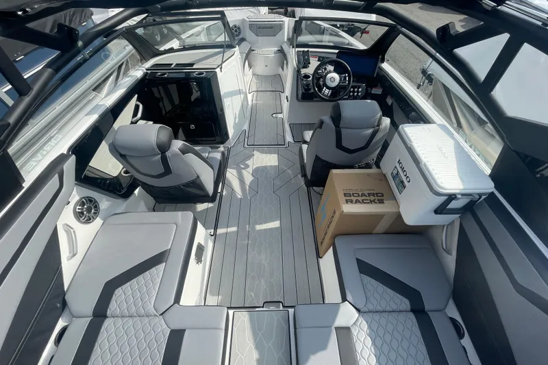 Slide: The Image of 2026 Yamaha Boats 222XD interior with modern seating, steering console, and storage features. - 14